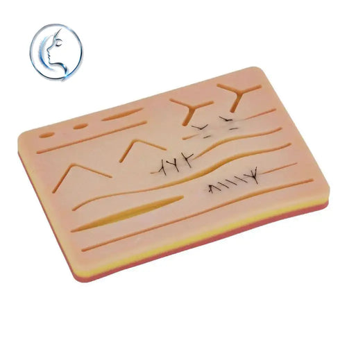 Beige 3-layer silicone training pad with molded incision patterns and black sutures for suturing practice